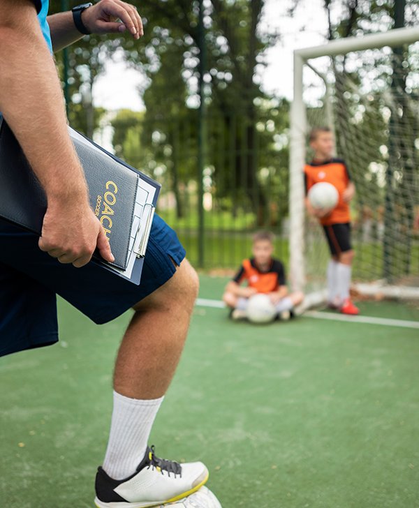 football trainer teaching his pupils